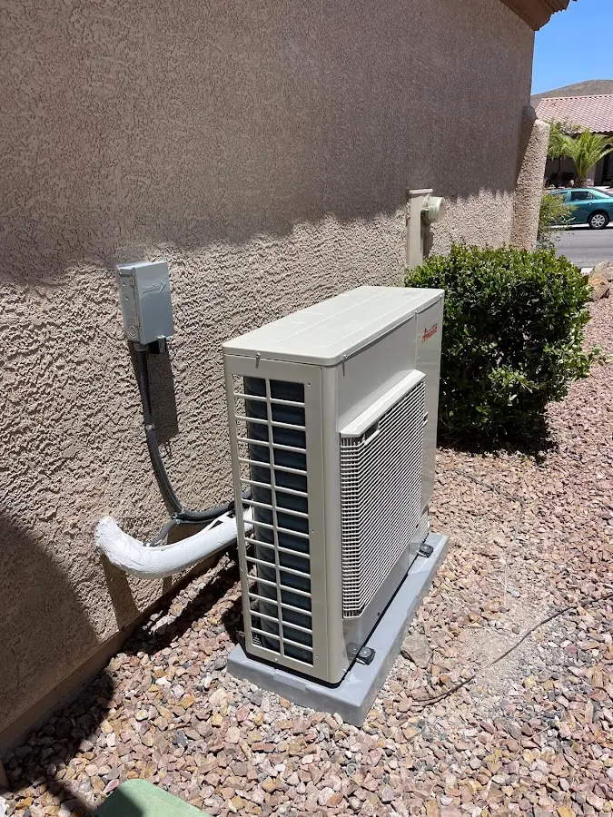 Residential air conditioning condenser unit in Center